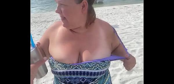  Slutty Bbw duca wife flashes her big tits on a public beach